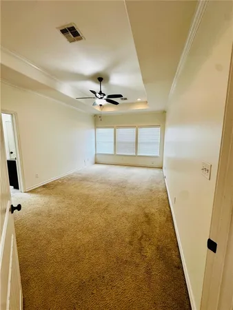 a view of an empty room with a fireplace