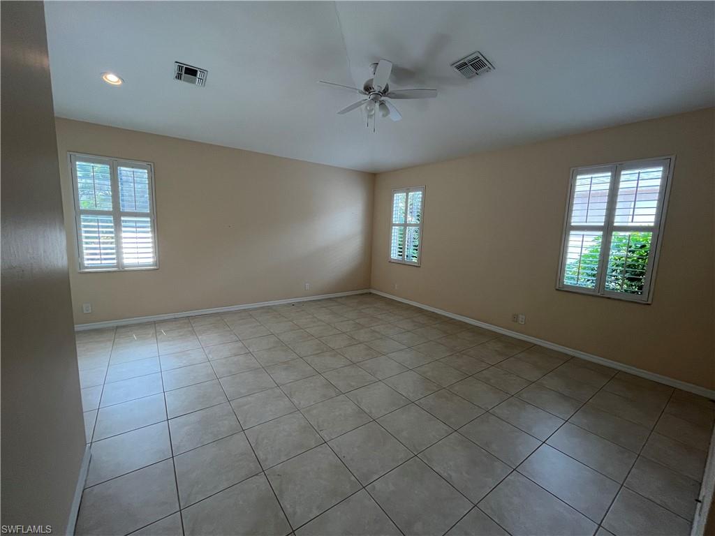 366 Burnt Pine Drive Naples, FL 34119 - Photo 11 of 36 a view of an empty room with a window
