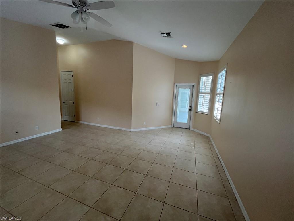 366 Burnt Pine Drive Naples, FL 34119 - Photo 12 of 36 a view of an empty room with a window