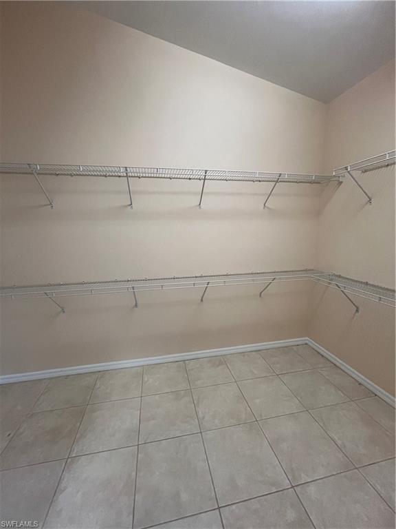 366 Burnt Pine Drive Naples, FL 34119 - Photo 15 of 36 a view of a room with racks on the wall