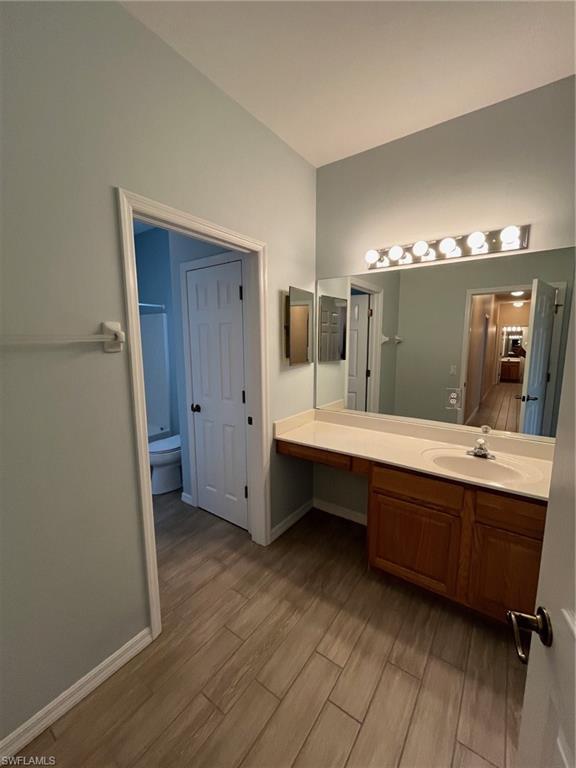366 Burnt Pine Drive Naples, FL 34119 - Photo 22 of 36 a spacious bathroom with a double vanity sink and mirror