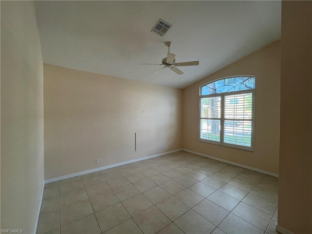 366 Burnt Pine Drive Naples, FL 34119 - Photo 4 of 36 a view of an empty room with a window
