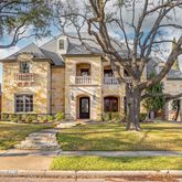 a view of a house with a large trees