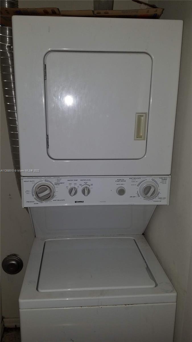 11050 Southwest 196th Street, Unit 305 Miami, FL 33157 - Photo 3 of 9 a close up view of washer and dryer