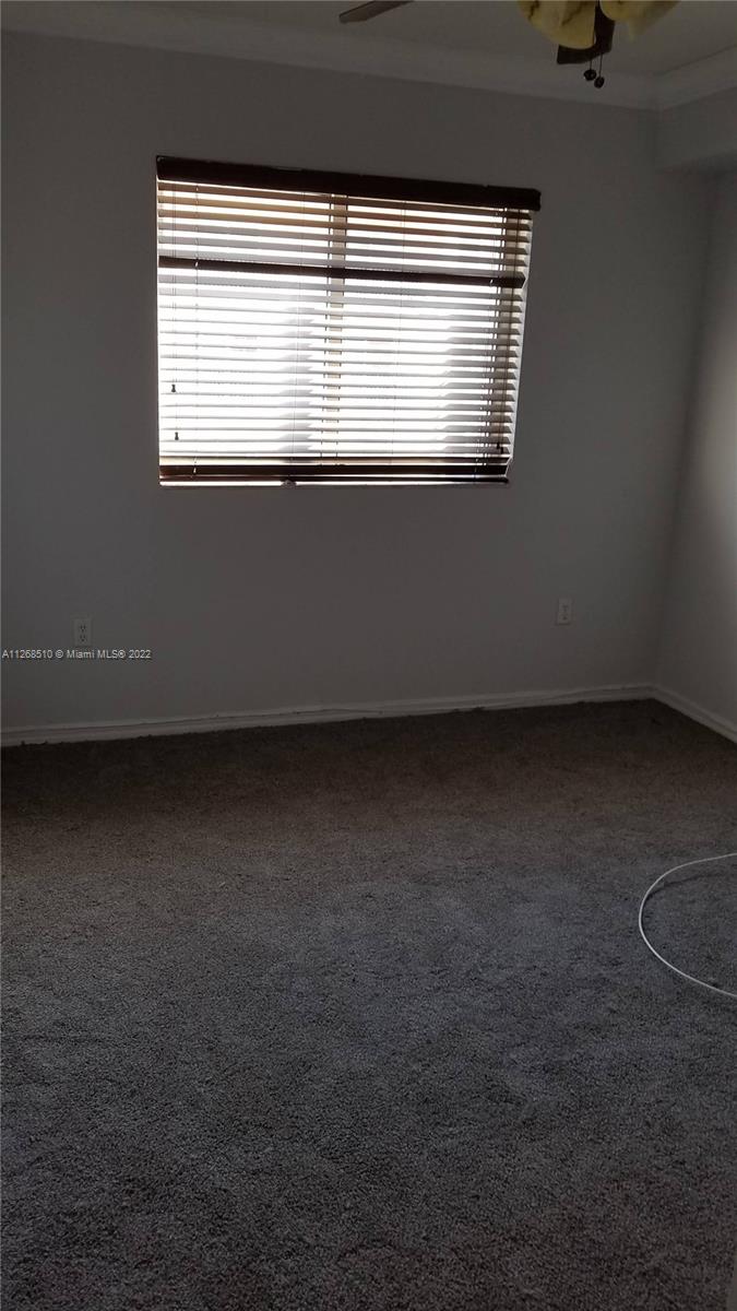 11050 Southwest 196th Street, Unit 305 Miami, FL 33157 - Photo 5 of 9 a view of room and window