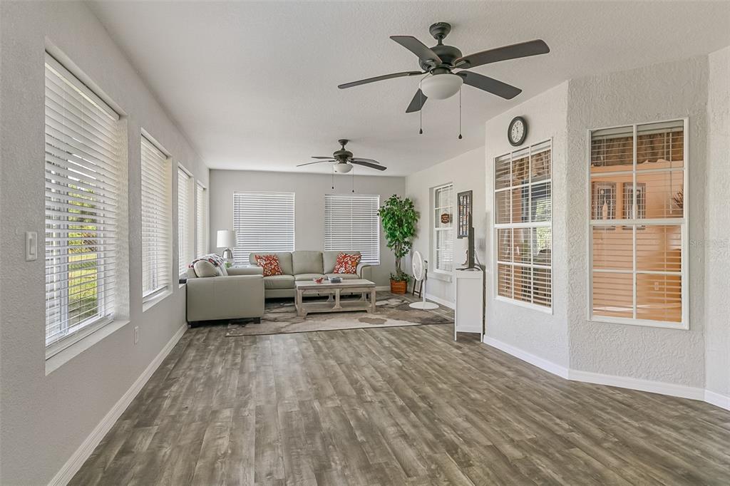 5740 Friendly Street Cocoa, FL 32927 - Photo 13 of 14 a living room with furniture and a large window