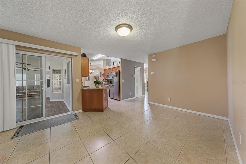 5740 Friendly Street Cocoa, FL 32927 - Photo 6 of 14 a view of an empty room with a kitchen