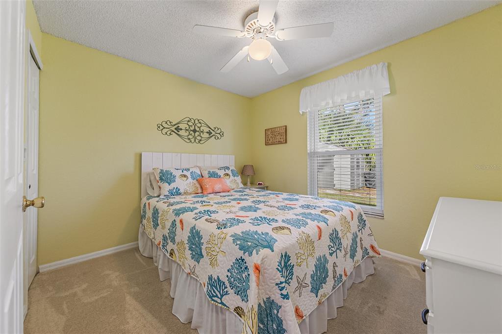 5740 Friendly Street Cocoa, FL 32927 - Photo 9 of 14 a bedroom with a bed and a window