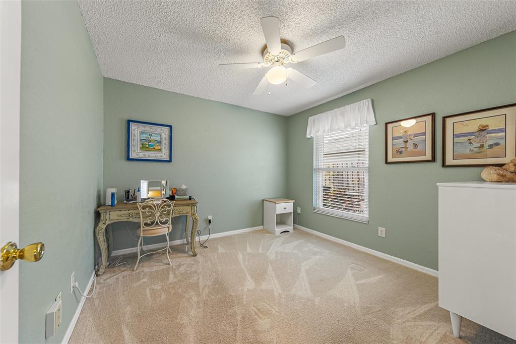 5740 Friendly Street Cocoa, FL 32927 - Photo 10 of 14 a view of a workspace with furniture and a window
