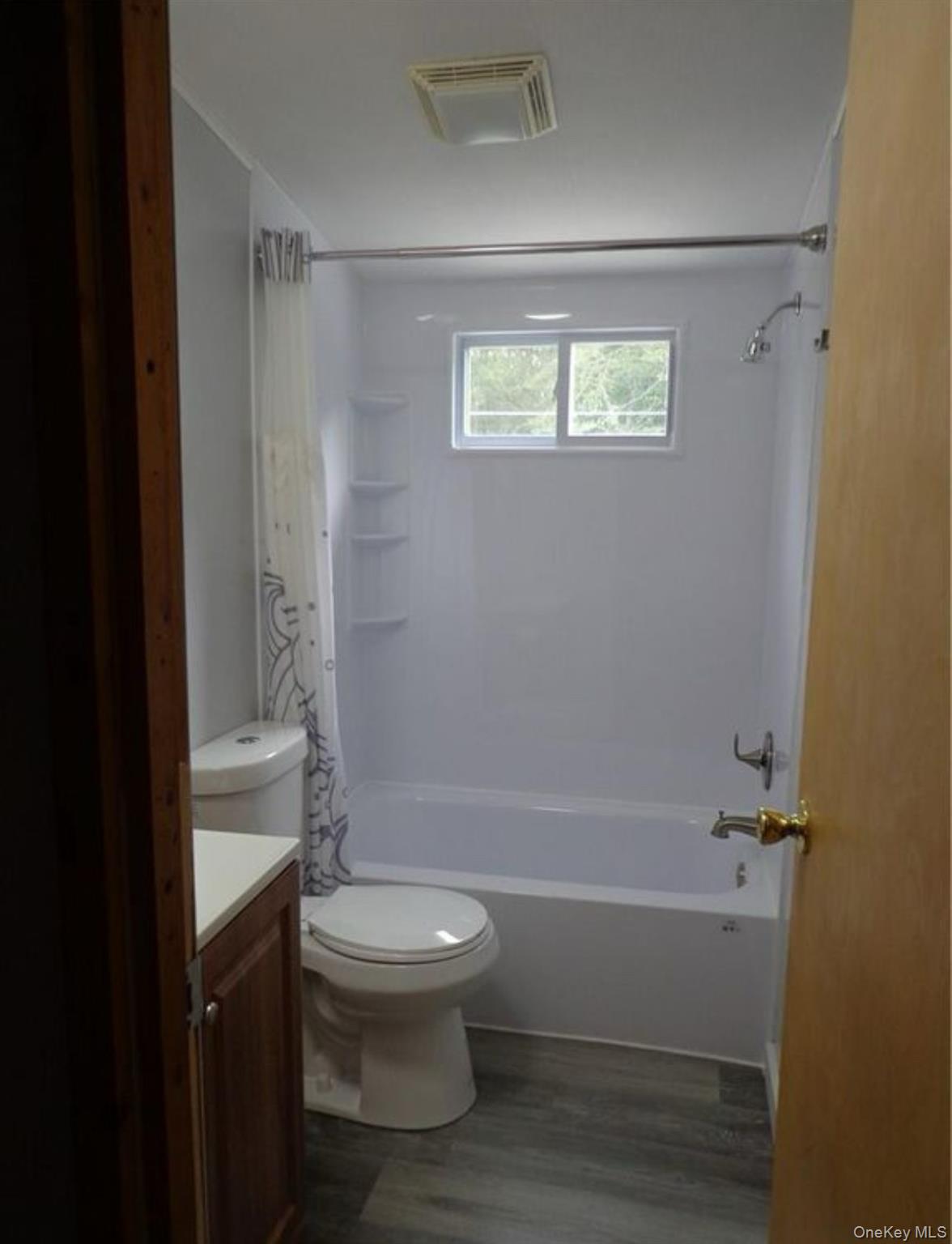 182-184 Mutton Hill Road Neversink, NY 12765 - Photo 11 of 34 a bathroom with a toilet and a shower