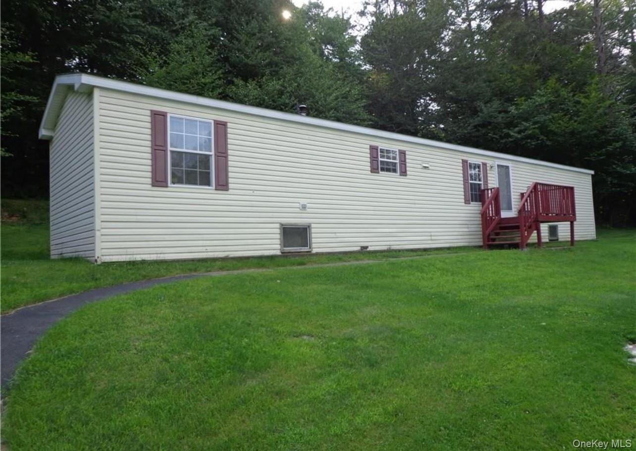 182-184 Mutton Hill Road Neversink, NY 12765 - Photo 24 of 34 a front view of house with yard and green space