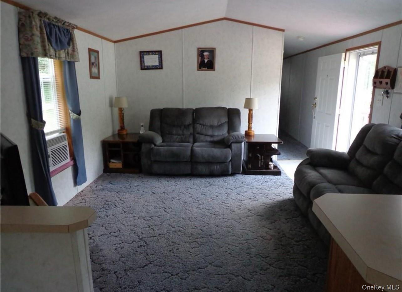 182-184 Mutton Hill Road Neversink, NY 12765 - Photo 31 of 34 a living room with furniture and a flat screen tv