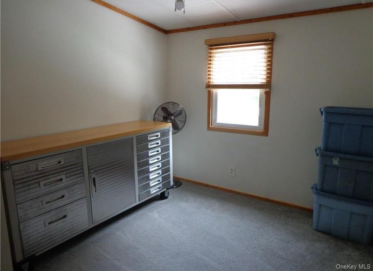 182-184 Mutton Hill Road Neversink, NY 12765 - Photo 9 of 34 an empty room with windows