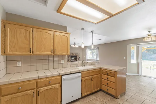 a kitchen with a stove and a sink