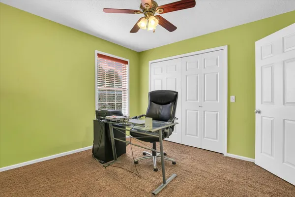 a bed room with a bed and a potted plant