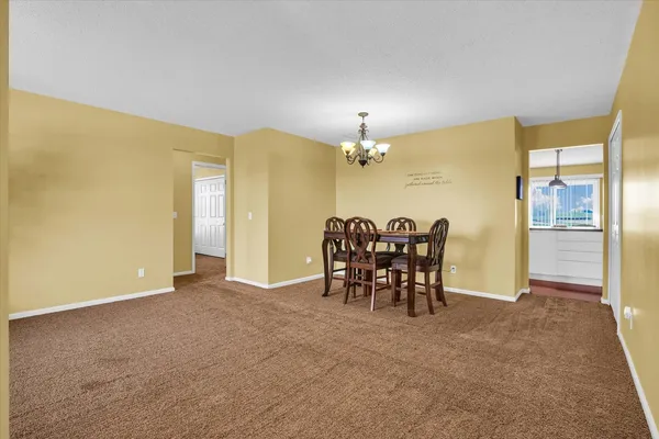 a view of a livingroom with furniture and a chandelier