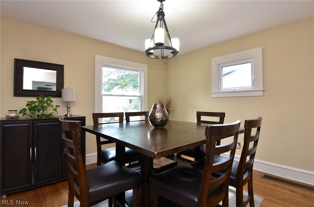 3584 Pennington Road Cleveland, OH 44120 - Photo 16 of 42 Dining area featuring a chandelier and hardwood / wood-style floors