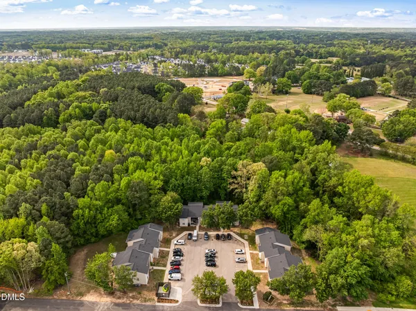 an aerial view of residential houses with outdoor space