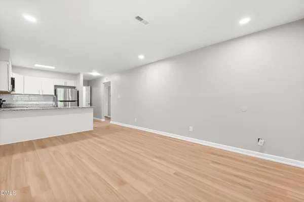 a view of kitchen with wooden floor
