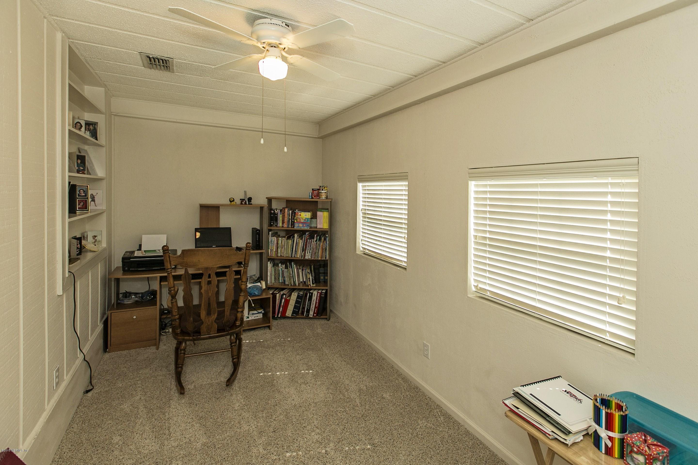 1712 Mayfair Road Jacksonville, FL 32207 - Photo 8 of 17 a view of a workspace with furniture and a window