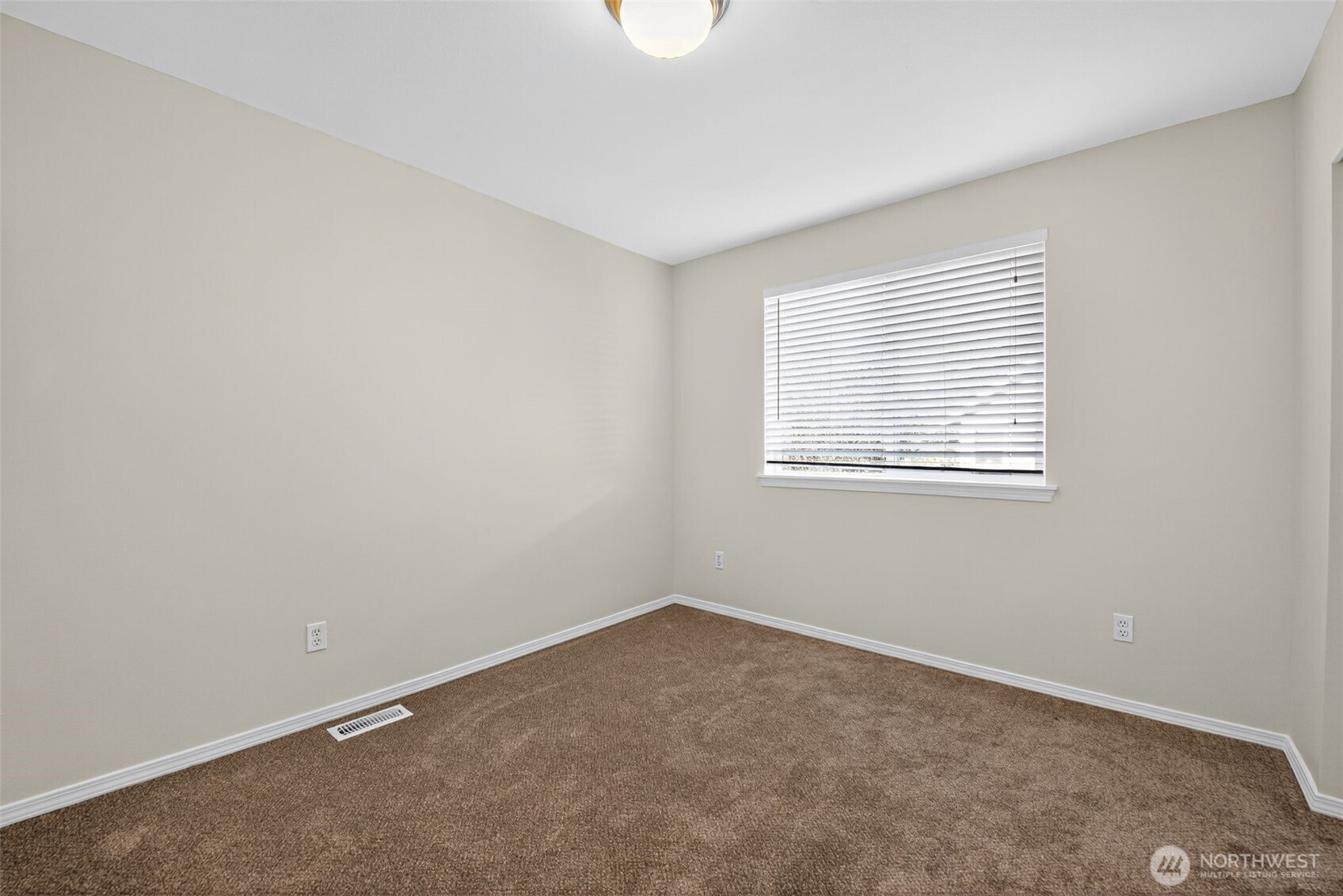 1005 Eagle Avenue Southwest Orting, WA 98360 - Photo 16 of 34 an empty room with a window