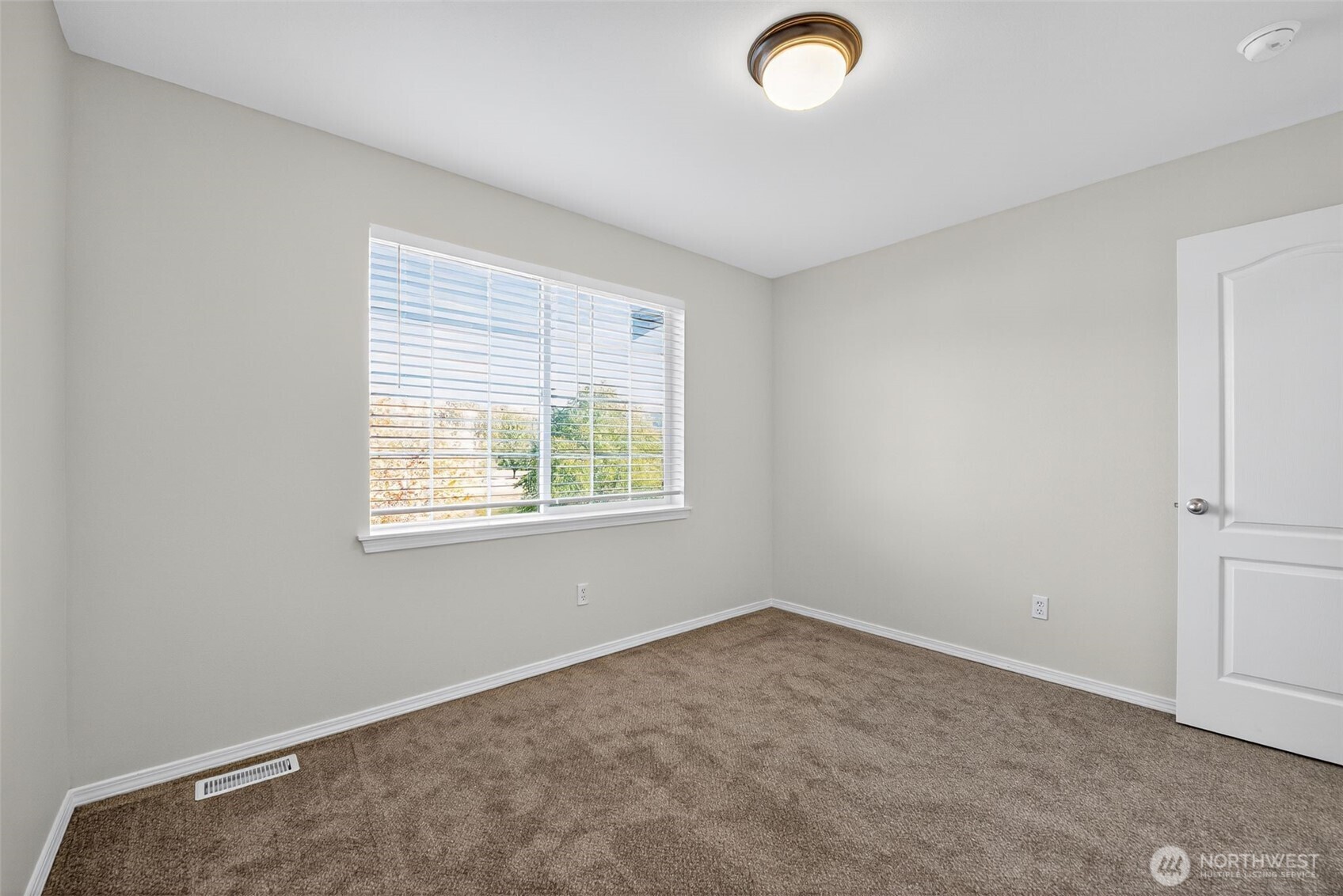 1005 Eagle Avenue Southwest Orting, WA 98360 - Photo 17 of 34 an empty room with a window