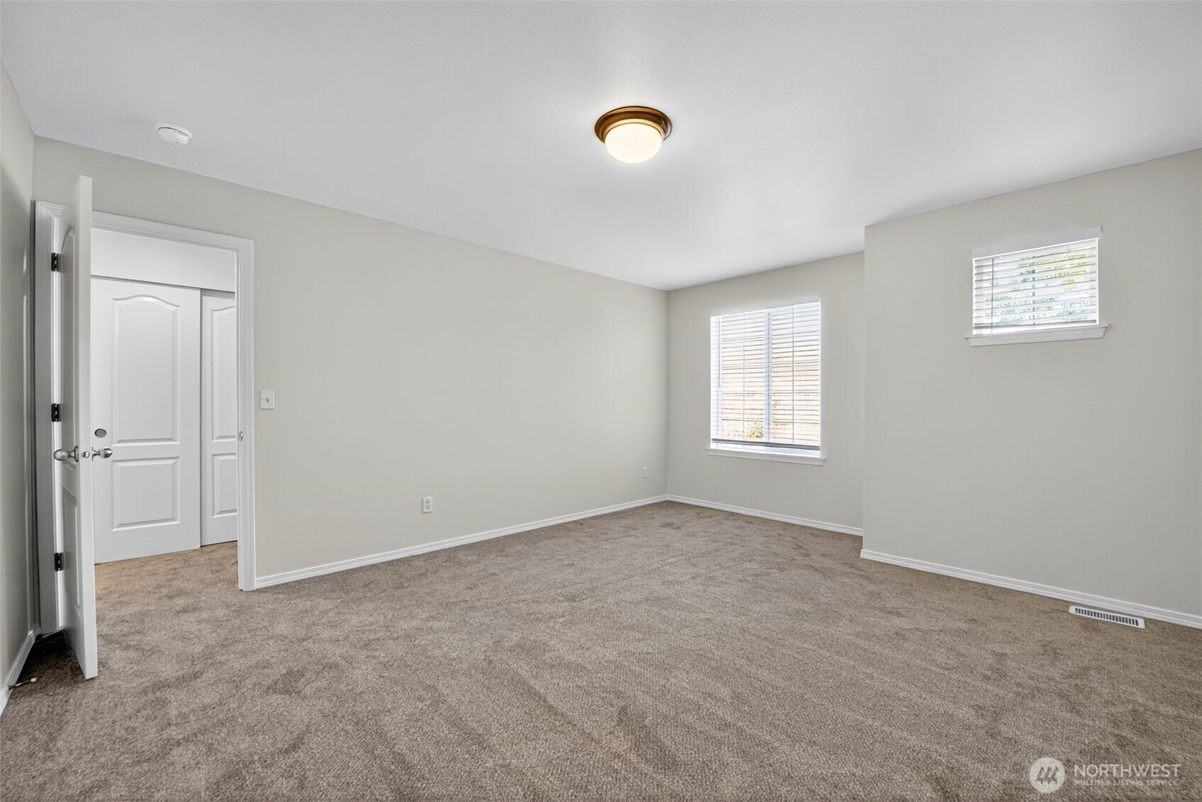 1005 Eagle Avenue Southwest Orting, WA 98360 - Photo 20 of 34 a view of an empty room with a window