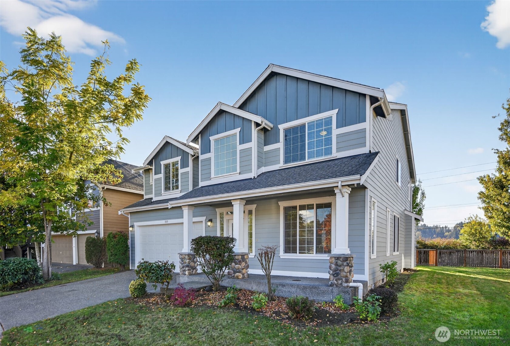 1005 Eagle Avenue Southwest Orting, WA 98360 - Photo 2 of 34 a front view of a house with garden