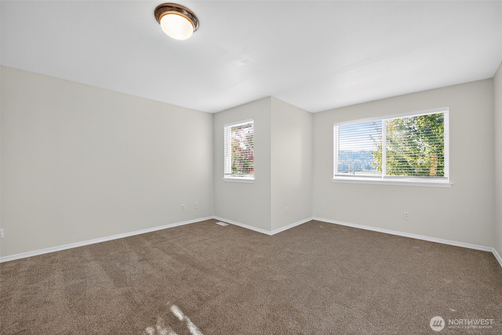 1005 Eagle Avenue Southwest Orting, WA 98360 - Photo 21 of 34 an empty room with windows