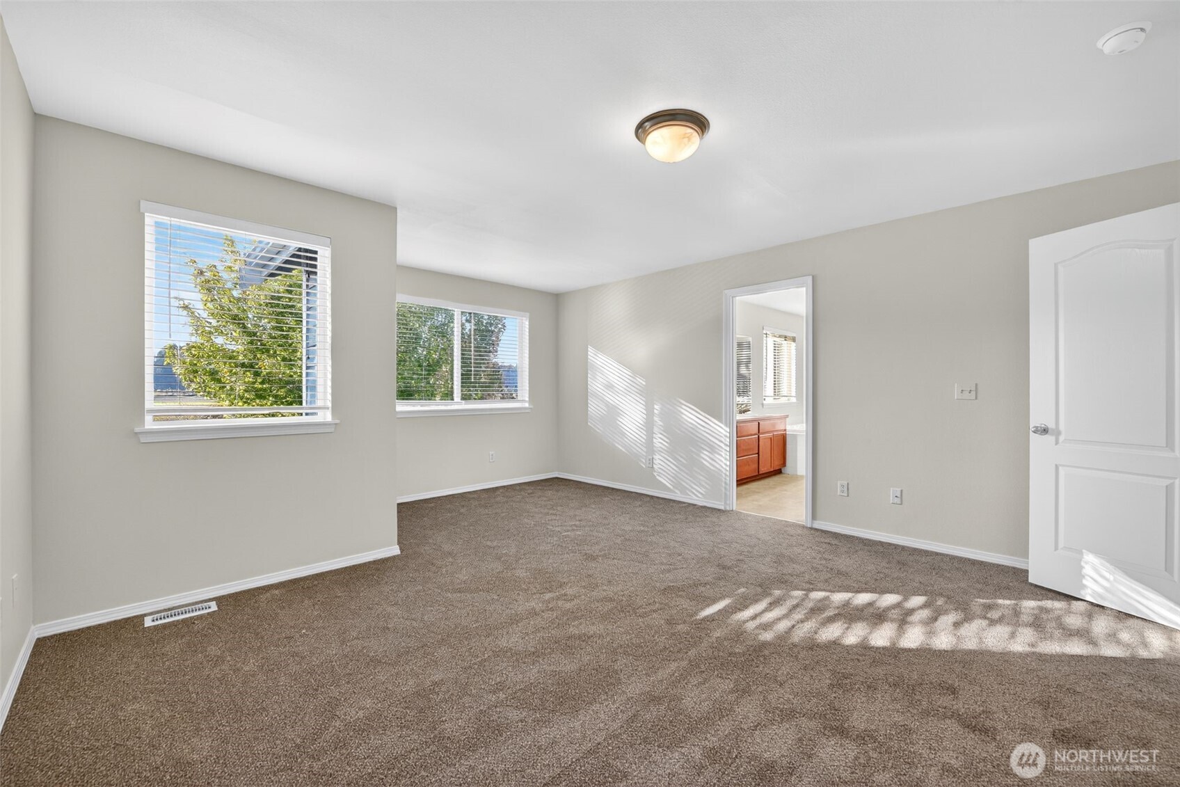 1005 Eagle Avenue Southwest Orting, WA 98360 - Photo 22 of 34 a view of empty room with wooden floor and fan