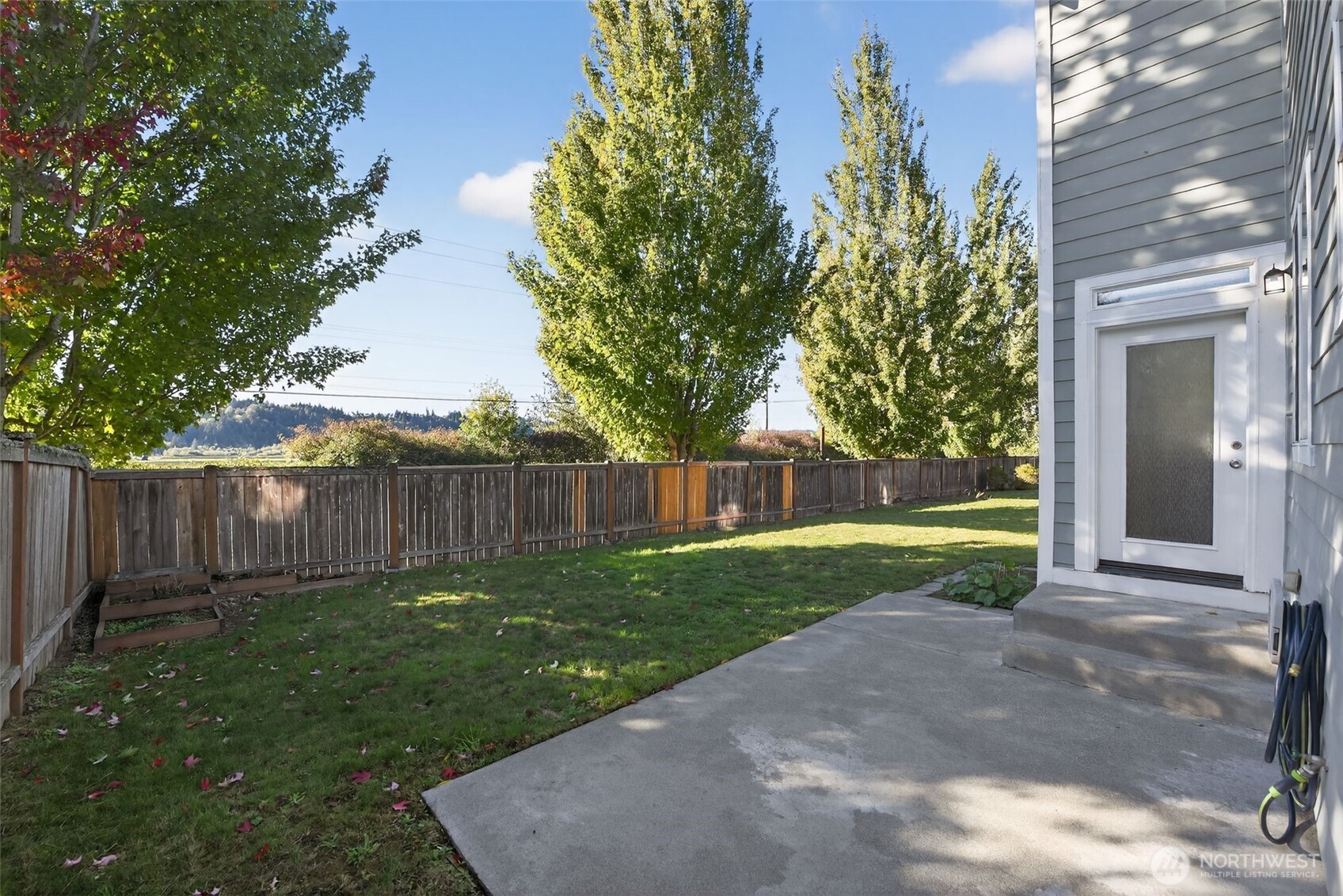 1005 Eagle Avenue Southwest Orting, WA 98360 - Photo 30 of 34 a view of a backyard with a garden