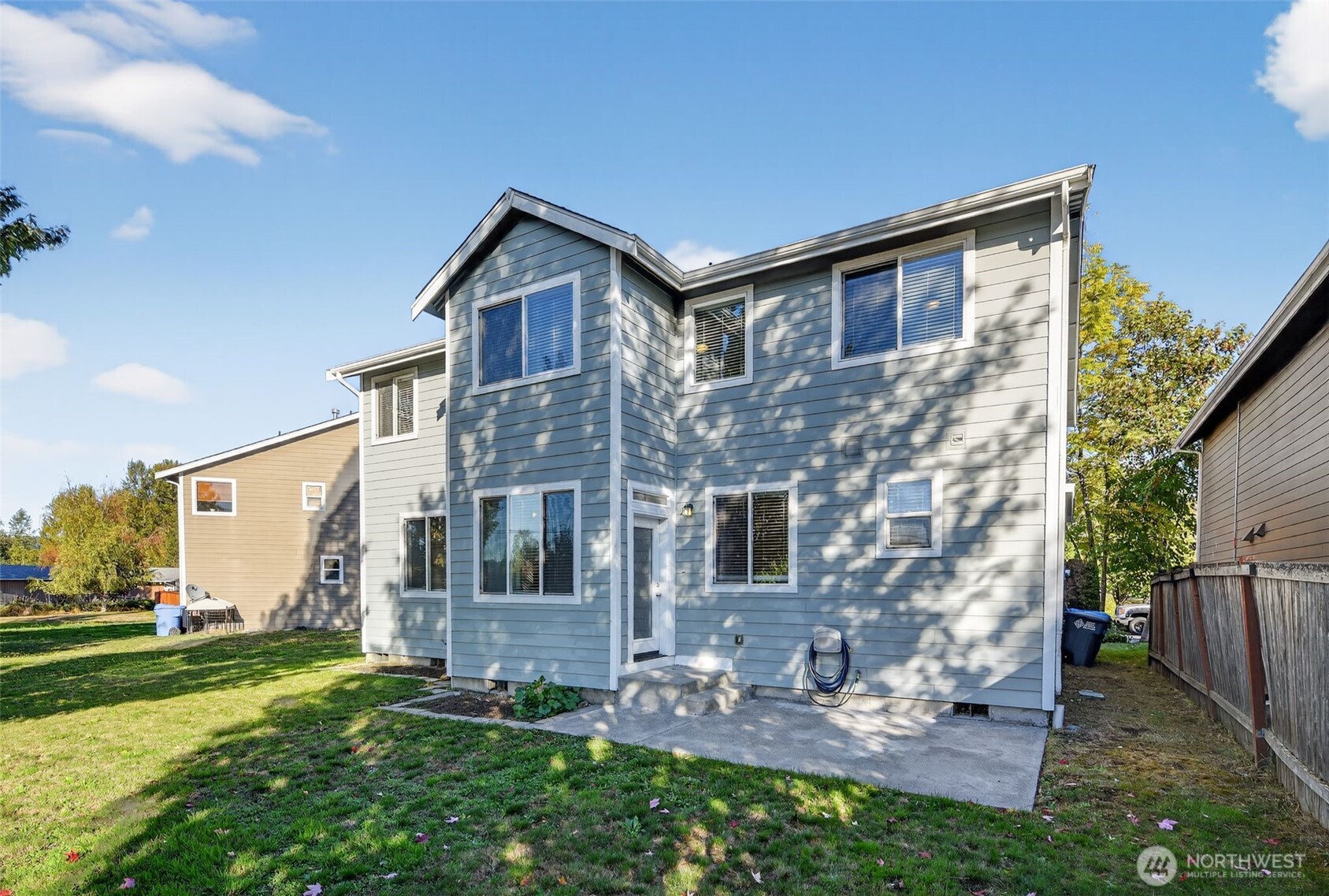 1005 Eagle Avenue Southwest Orting, WA 98360 - Photo 31 of 34 a front view of a house with a yard