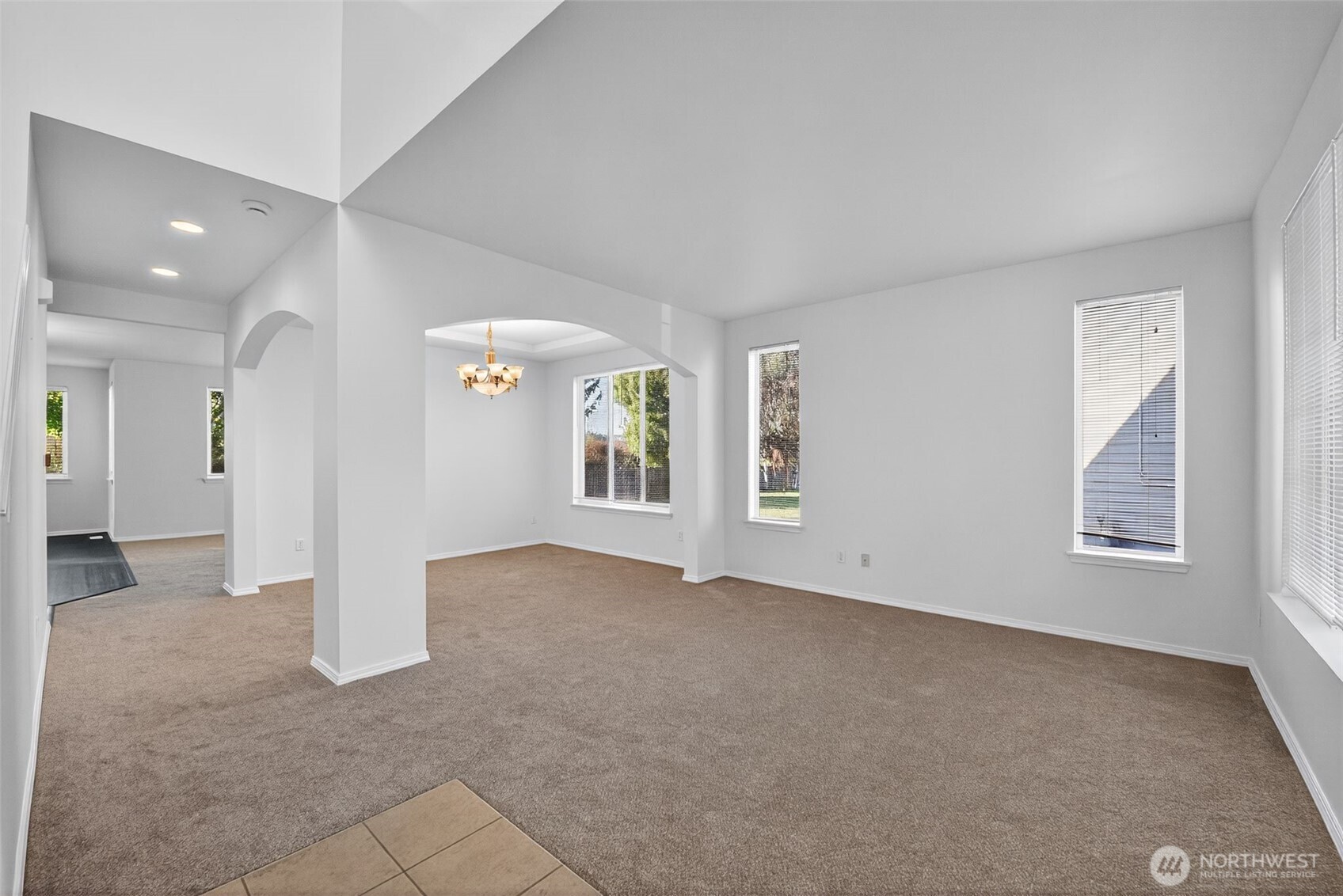 1005 Eagle Avenue Southwest Orting, WA 98360 - Photo 8 of 34 an empty room with windows and entrance