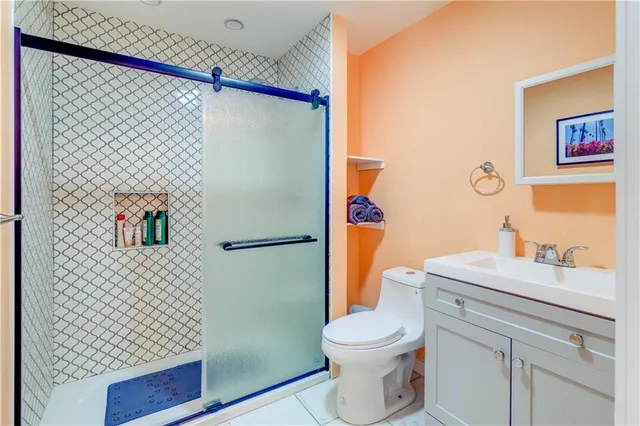 a bathroom with a sink vanity and a mirror