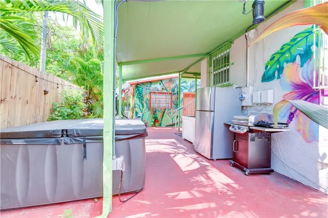 a kitchen with a refrigerator and a sink