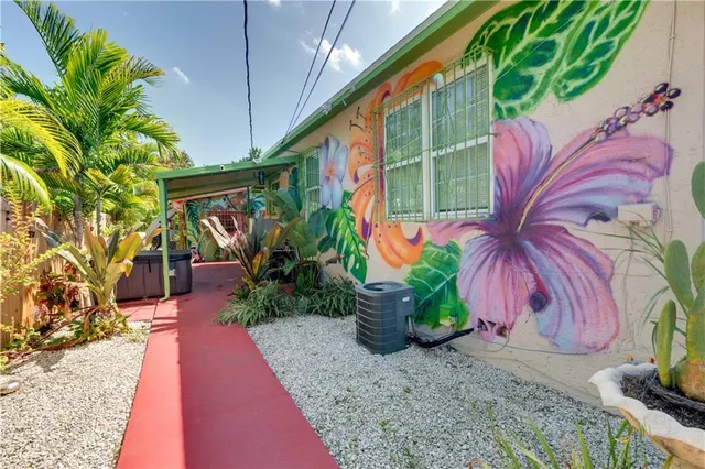 a kitchen with a table chairs refrigerator and cabinets