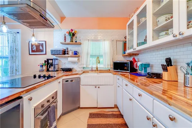 a kitchen with a dining table and chairs