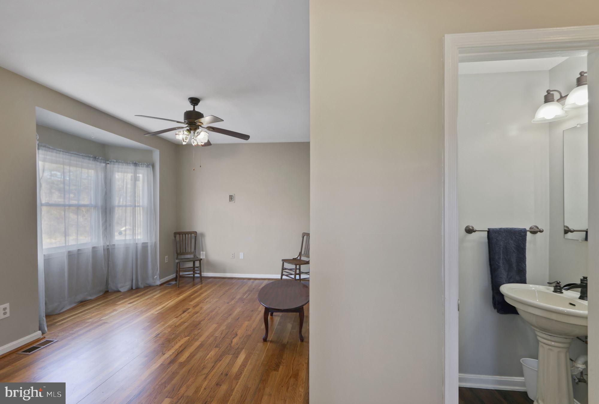 2734 Crooked Run Road Delaplane, VA 20144 - Photo 14 of 38 Living room and powder room