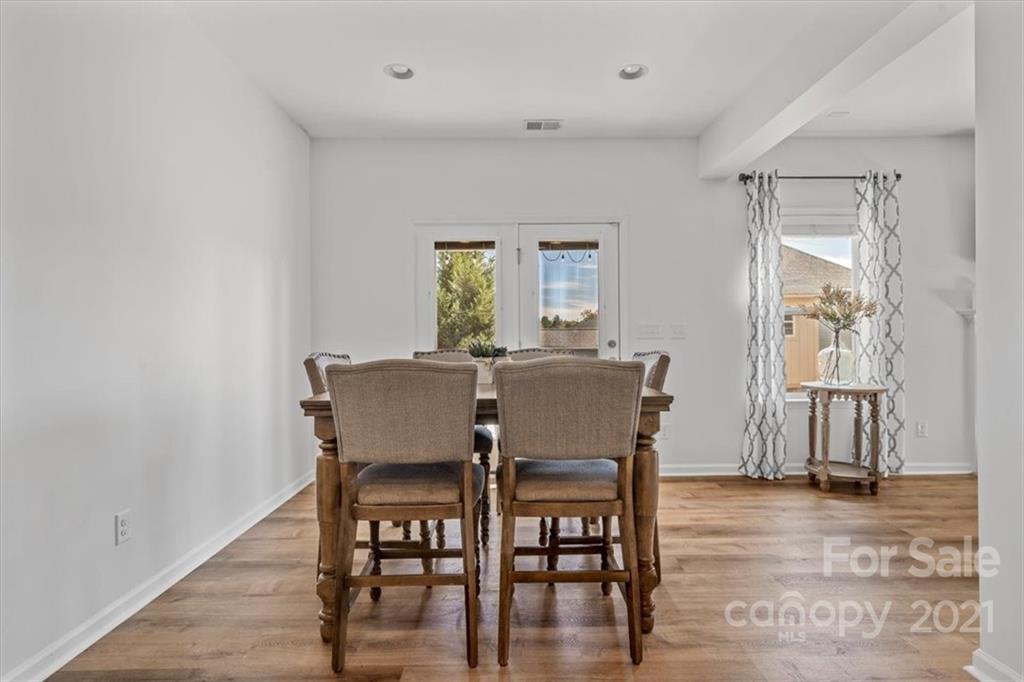 86646 Arrington Road Lancaster, SC 29720 - Photo 14 of 42 a view of a dining room with furniture and wooden floor