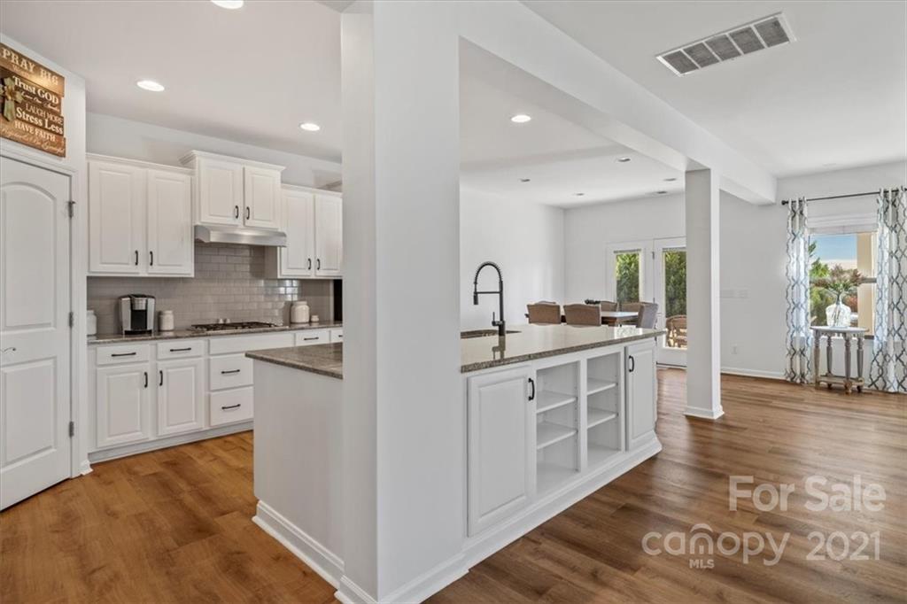 86646 Arrington Road Lancaster, SC 29720 - Photo 16 of 42 a kitchen with white cabinets and appliances