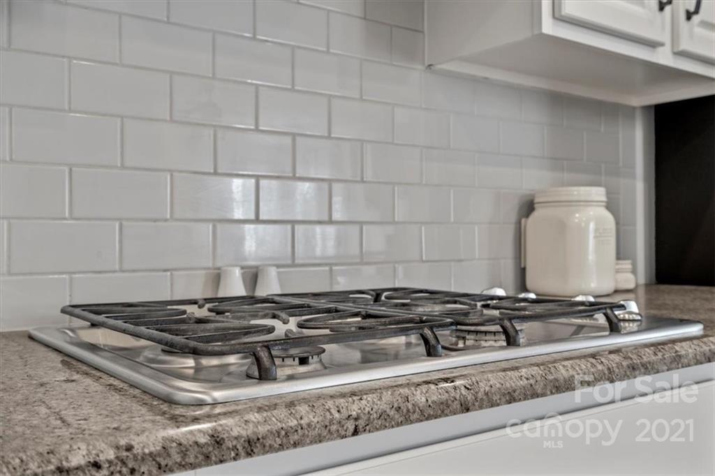 86646 Arrington Road Lancaster, SC 29720 - Photo 19 of 42 a stove top oven sitting inside of a kitchen