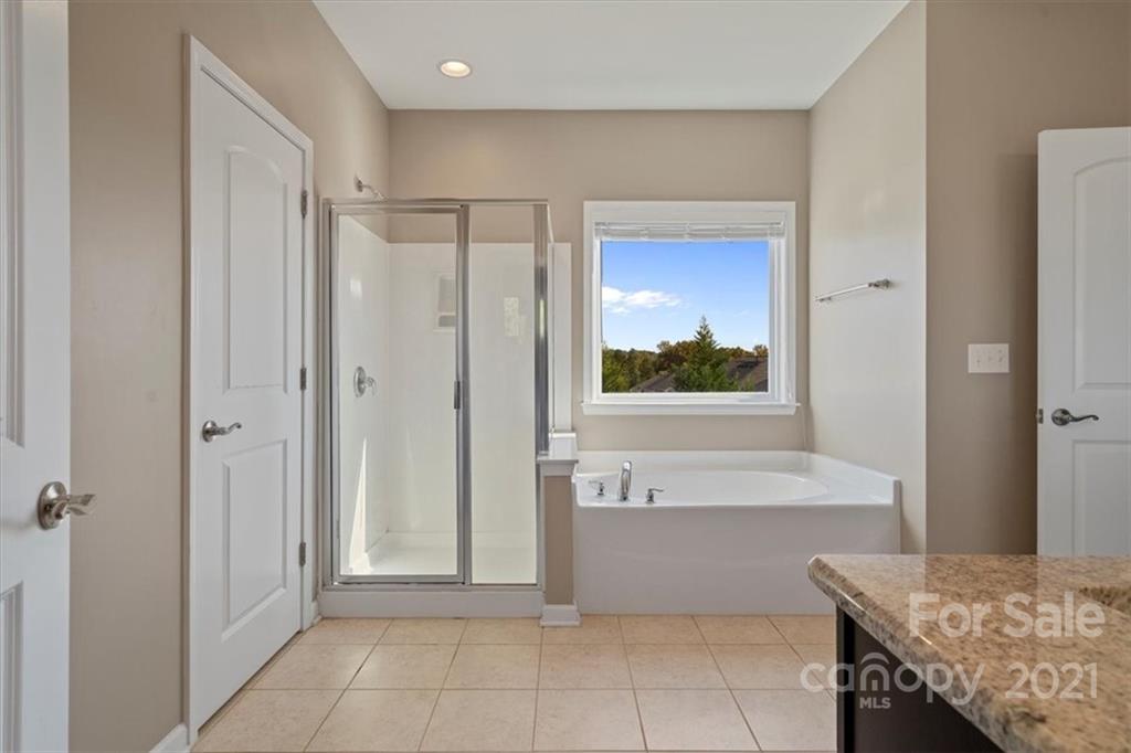 86646 Arrington Road Lancaster, SC 29720 - Photo 33 of 42 a bathroom with a tub shower and sink