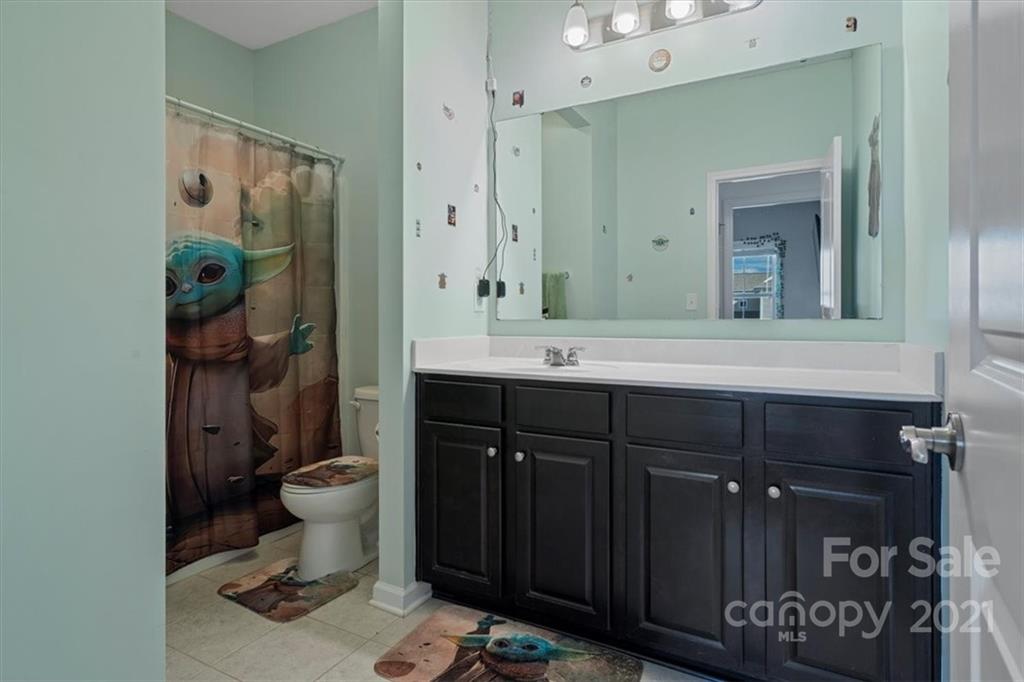 86646 Arrington Road Lancaster, SC 29720 - Photo 35 of 42 a bathroom with a sink vanity granite and toilet