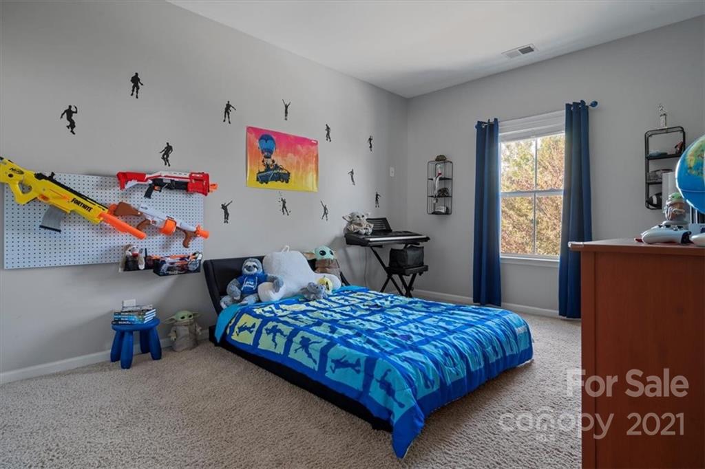 86646 Arrington Road Lancaster, SC 29720 - Photo 36 of 42 a bedroom with bed and a window