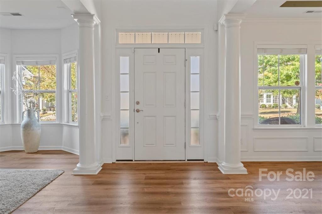 86646 Arrington Road Lancaster, SC 29720 - Photo 5 of 42 a view of an empty room with wooden floor and a window