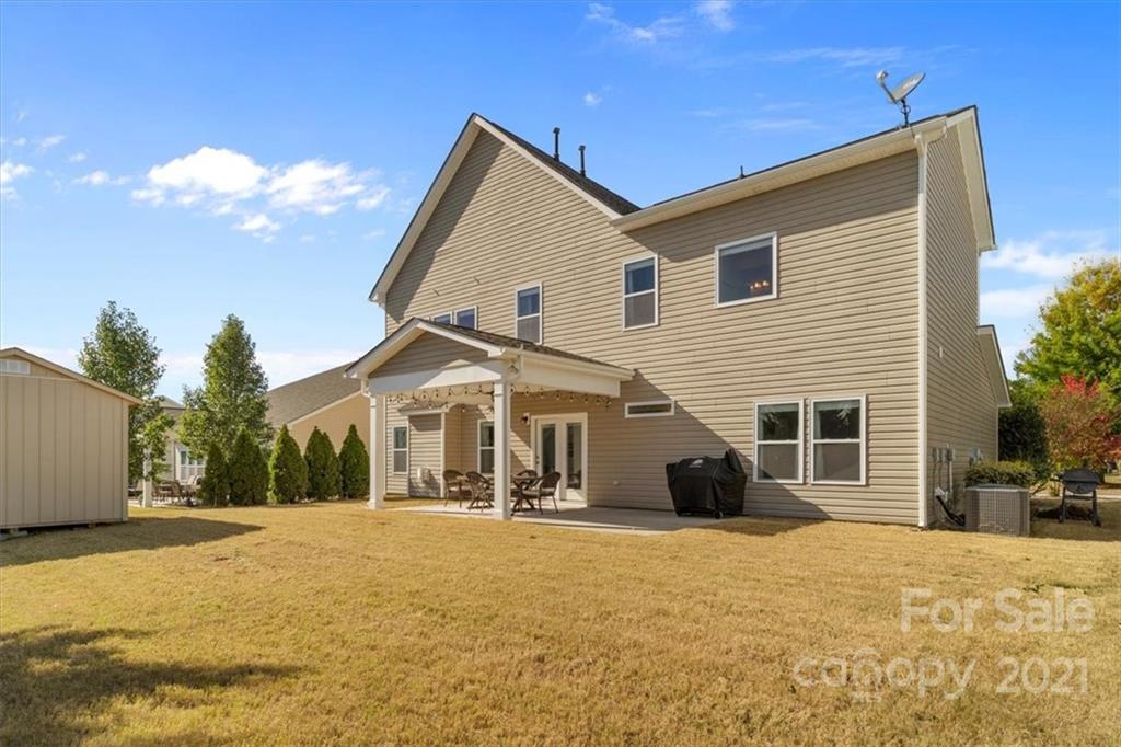86646 Arrington Road Lancaster, SC 29720 - Photo 42 of 42 a view of a house with a barbeque and wooden fence