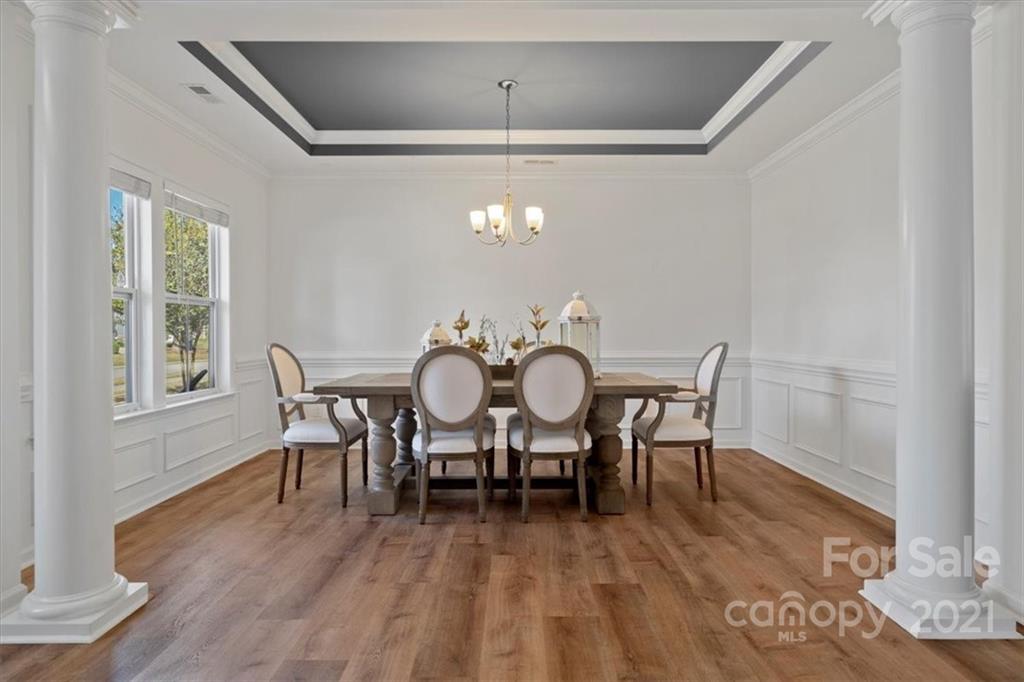 86646 Arrington Road Lancaster, SC 29720 - Photo 8 of 42 a view of a dining room with furniture window and wooden floor