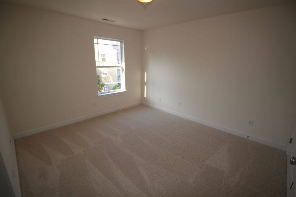 251 Broadgait Brae Road Cary, NC 27519 - Photo 18 of 25 Third Bedroom on Third Level with NEW carpet. Bedroom