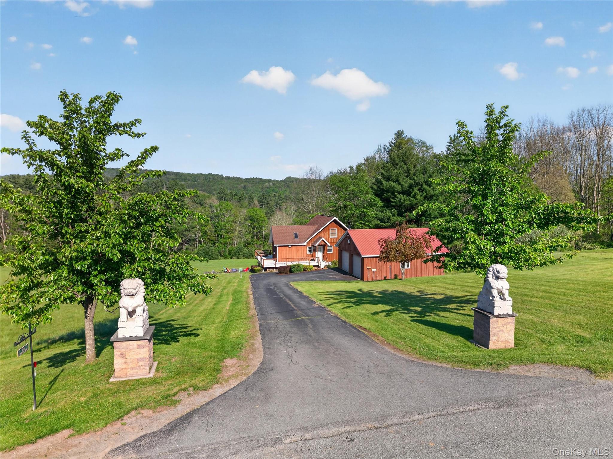 340 Hospital Road Callicoon, NY 12723 - Photo 30 of 41 a front view of a house with a yard and a garden