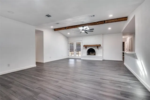 a view of living room with wooden floor
